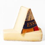Extra Aged Comté - A Deli Holiday Exclusive A photo of two wedges of Comte, one resting on the other.