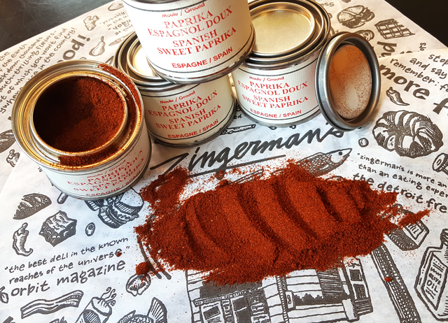 Paprika 210 tins and spice spread out on a Zingerman's sheet