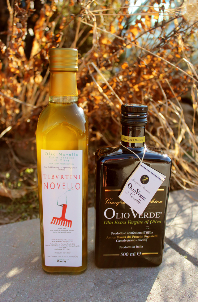 Zingerman's 2019 Olio Nuevo bottles outside in the sunset - New Harvest Olive Oils