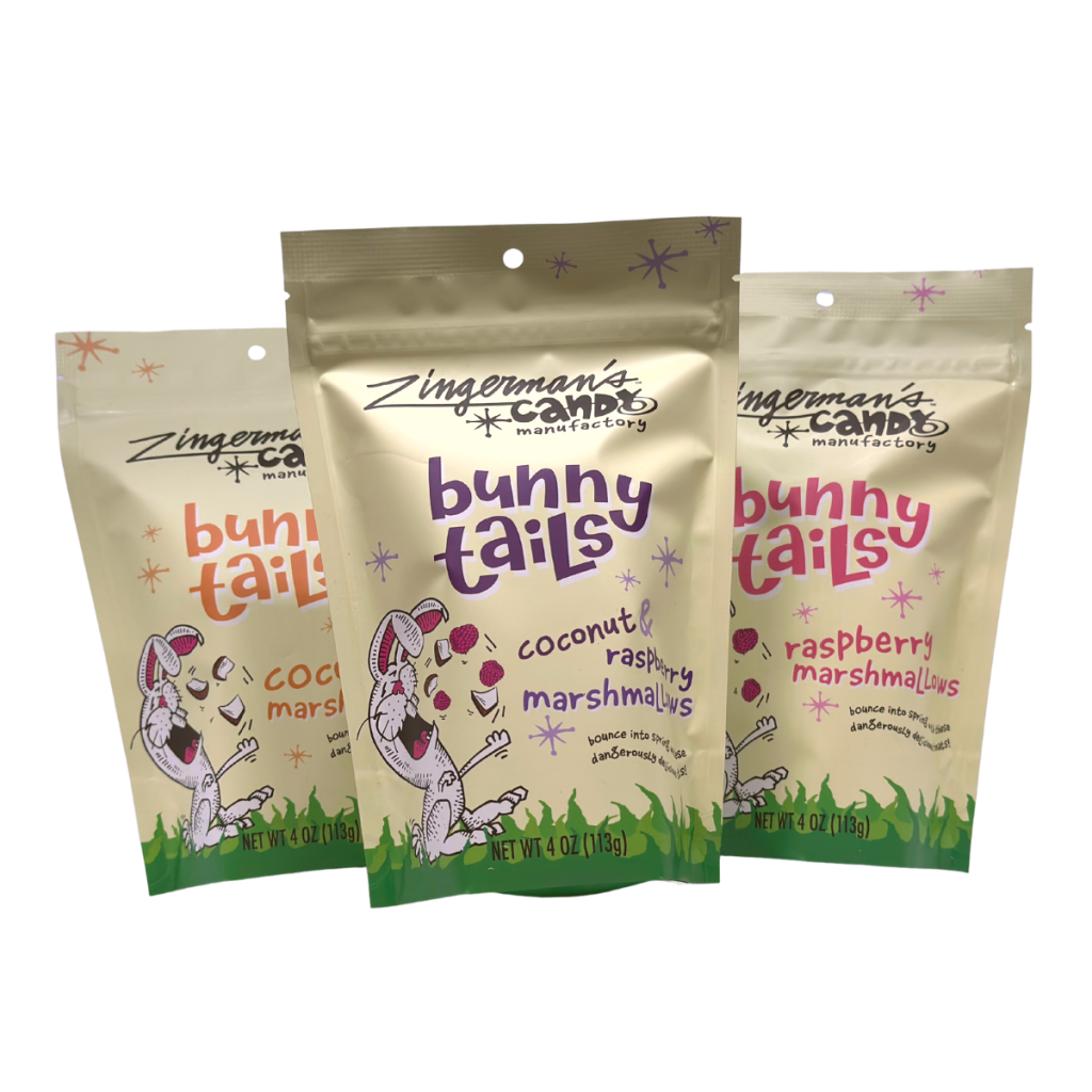 A photo of three bags of Bunny Tails, each with a cartoon of a bunny enjoying the bunny tails on the front.
