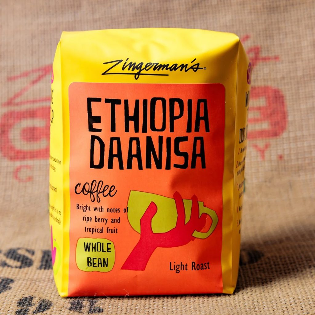 A photo of a bag of Ethiopia Daanisa beans against a burlap coffee bag background.