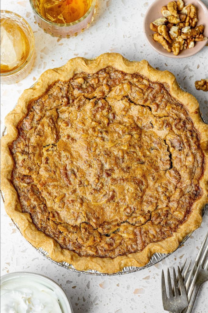 A top-down photo of a Run For The Roses Pie on a marble surface.